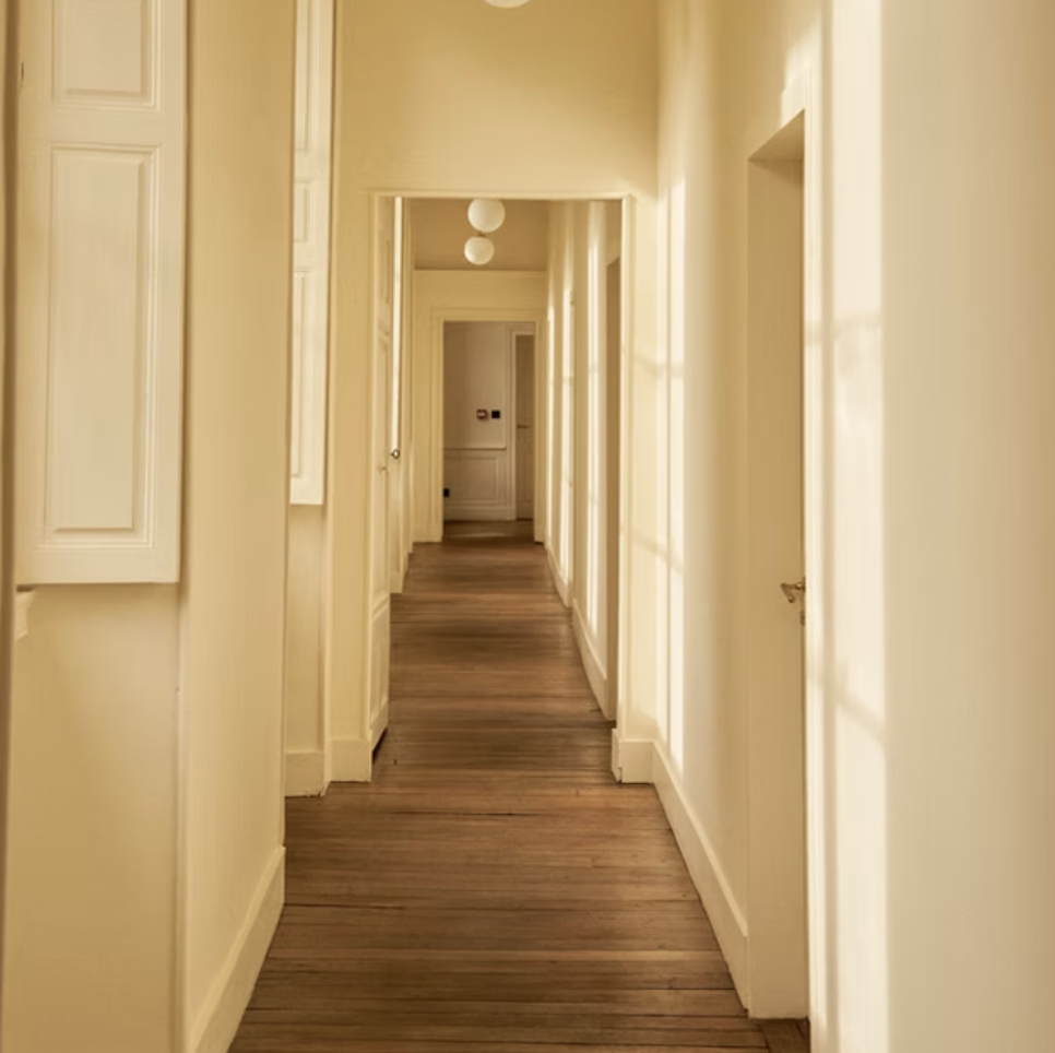 A sunlit hallway inside the château